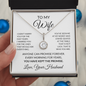Hand holding the To My Wife necklace gift box, an anniversary gift for wife from husband