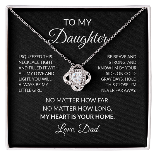 A silver necklace with a clear crystal pendant displayed on a black gift card with sentimental text addressed to a daughter, labeled 'TO MY Daughter' and signed 'Love, Dad'.