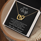 To My Wife Interlocking Hearts necklace and message card in a white gift box on wood