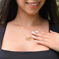 Woman wearing the yellow gold Interlocking Hearts necklace